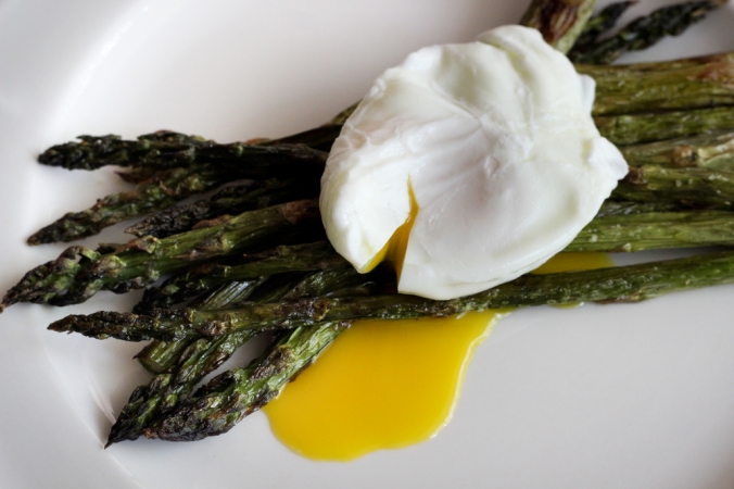Roasted asparagus topped with a poached egg