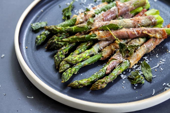 Grilled asparagus wrapped in parma ham